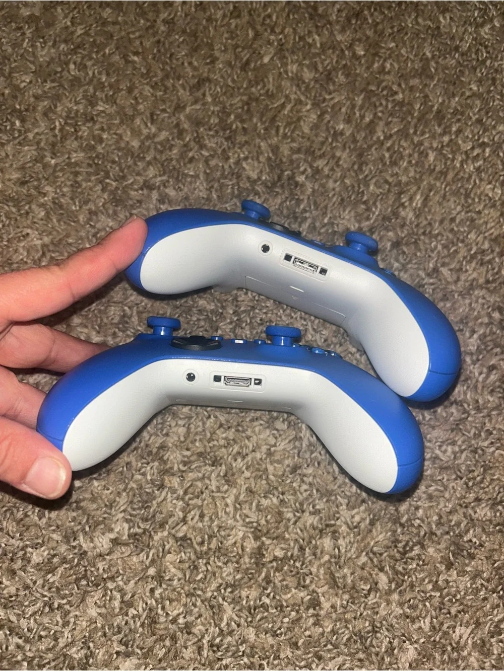 Two Blue Xbox Wireless Controllers